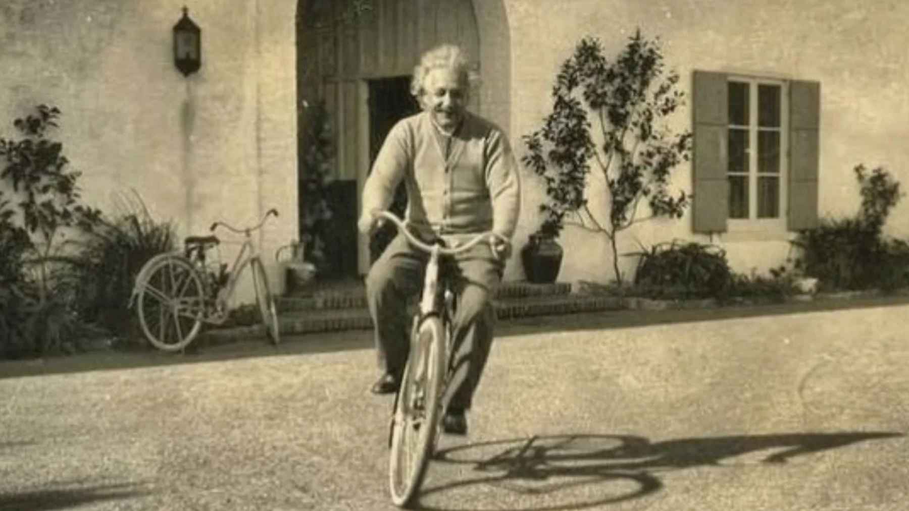 Albert Einstein, scientist: “Life is like riding a bicycle: if you want to keep your balance, you have to keep pedaling” 1 Albert Einstein riding a bicycle outside his home, illustrating his famous quote about life and balance