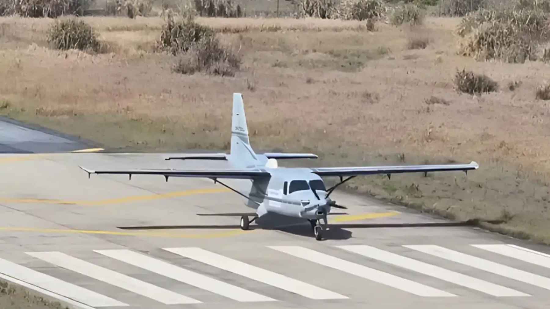 Hydrogen-powered turboprop aircraft taxiing on runway during AEP100 test in China.
