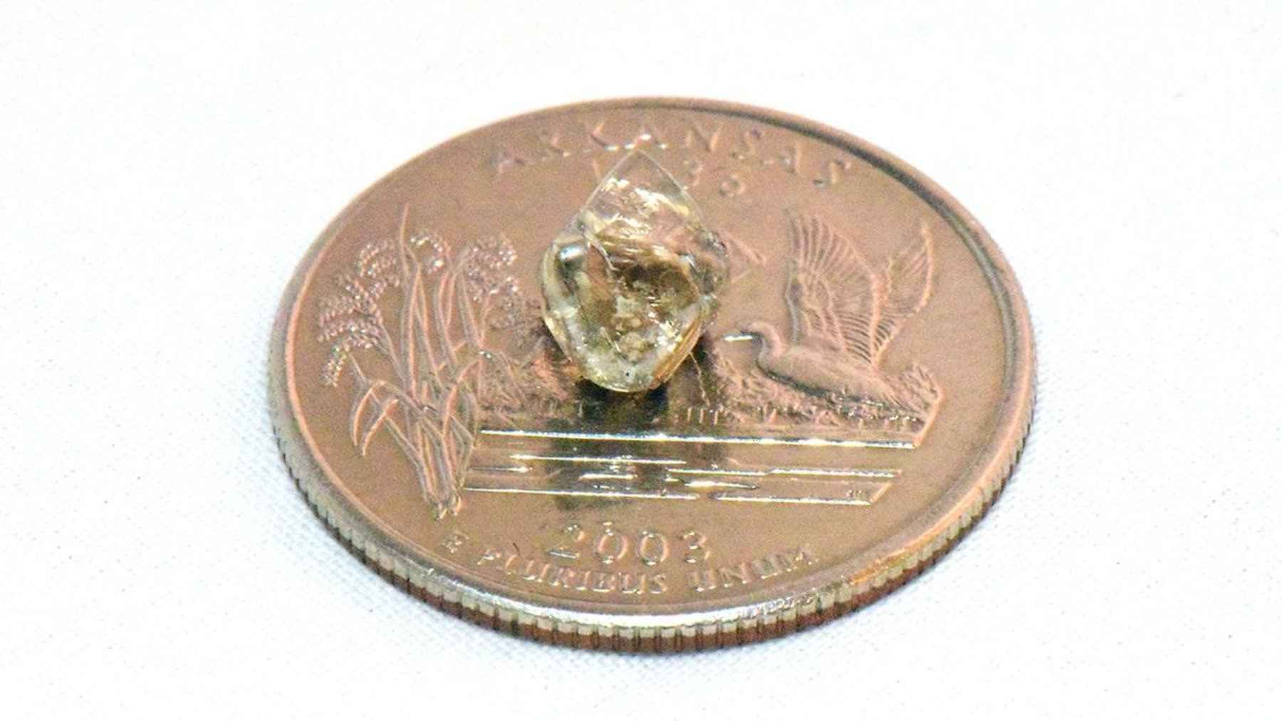 A New York tourist finds a diamond the size of a human tooth, and a casual visit turns into a once-in-a-lifetime geology story 1 A 2.30-carat white diamond found by Micherre Fox at Crater of Diamonds State Park in Arkansas.