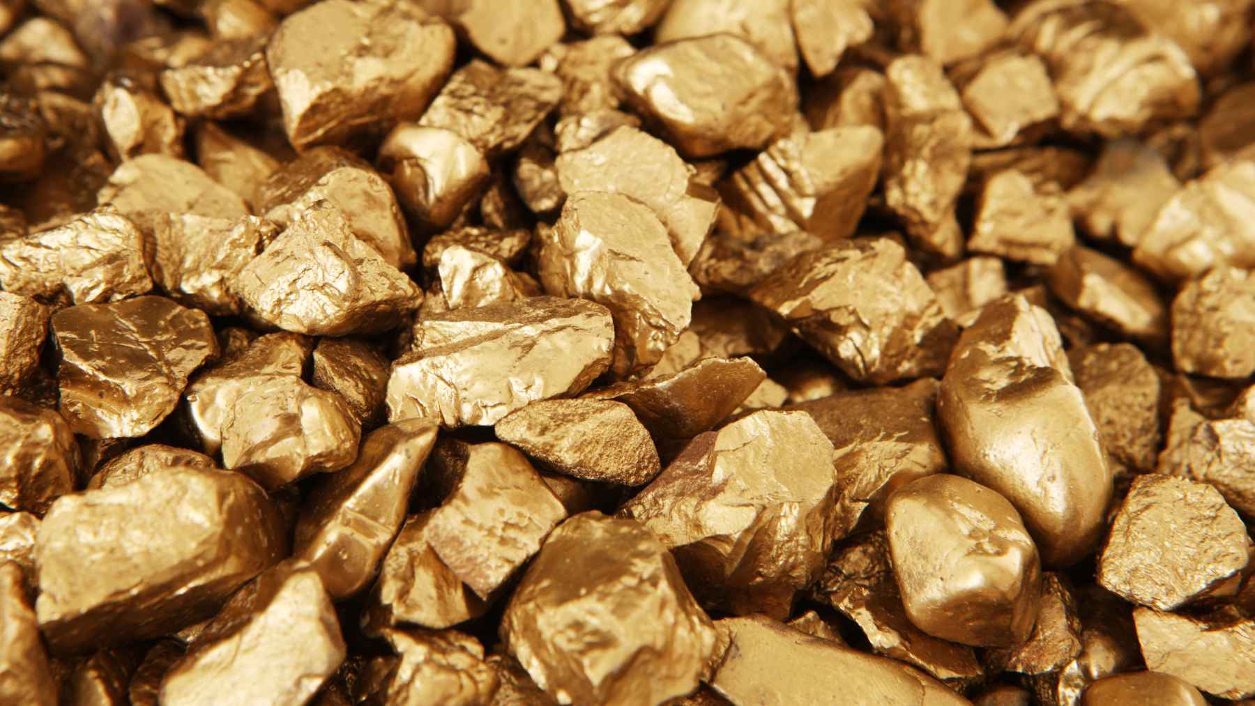 Close-up of raw gold nuggets, linked to Kazakhstan’s reported discovery of gold and strategic mineral deposits.