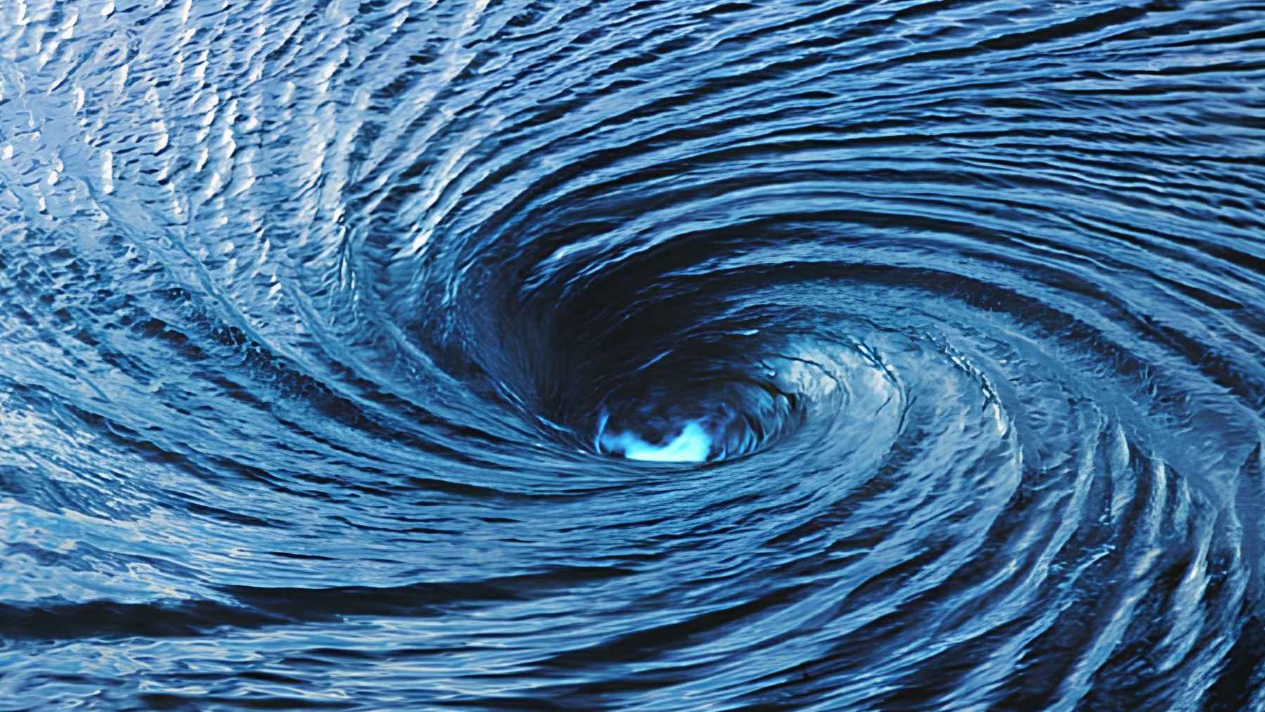 Ocean eddies interacting with a major coastal current linked to warming and hidden upwelling effects