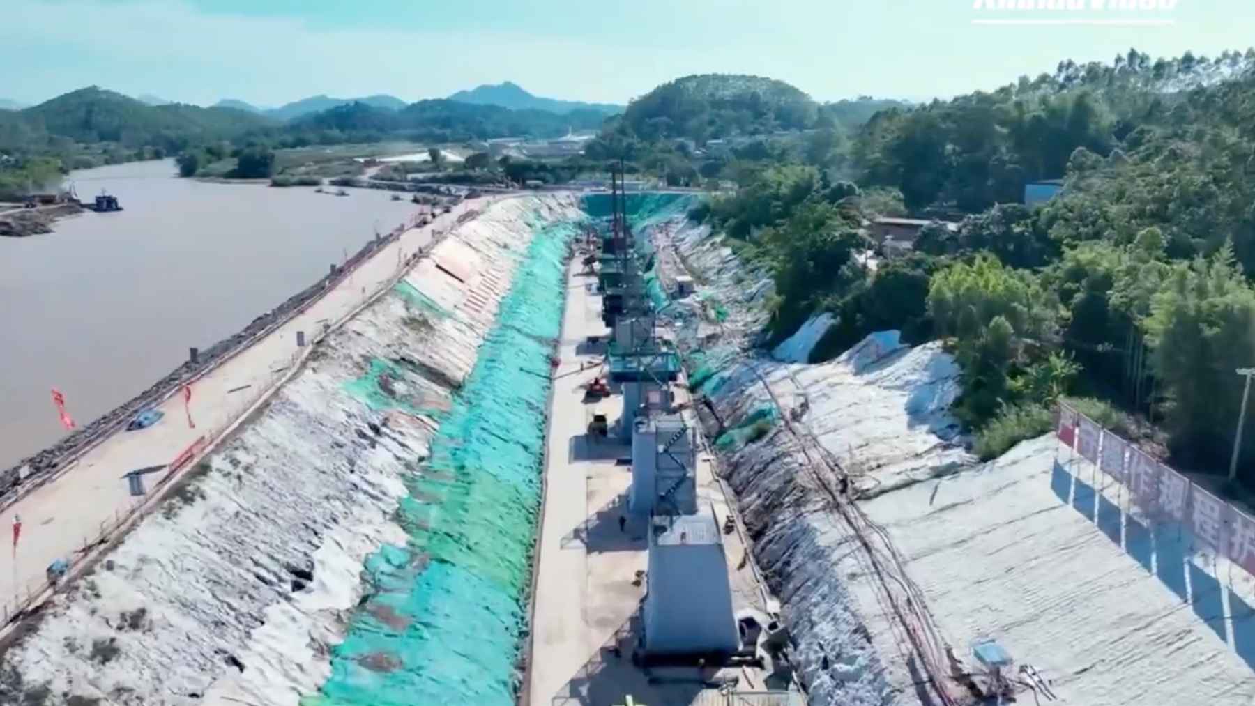 China is cutting a 134-kilometer canal so ships can enter deep into river routes, and the project shows how seriously Beijing is redrawing natural borders for trade 1 Construction site of the Pinglu Canal in China with excavated channel and heavy machinery