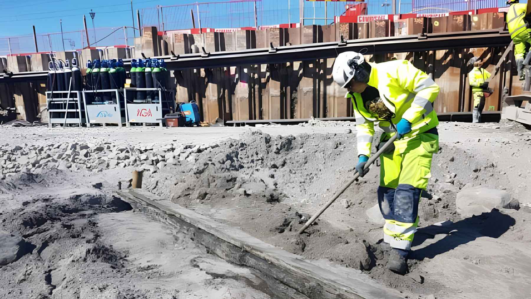 Construction workers in Sweden uncovered six centuries-old shipwrecks where no one expected them, and the discovery has opened a forgotten chapter beneath modern ground 1 Construction worker excavating a wooden shipwreck structure uncovered beneath urban ground in Sweden