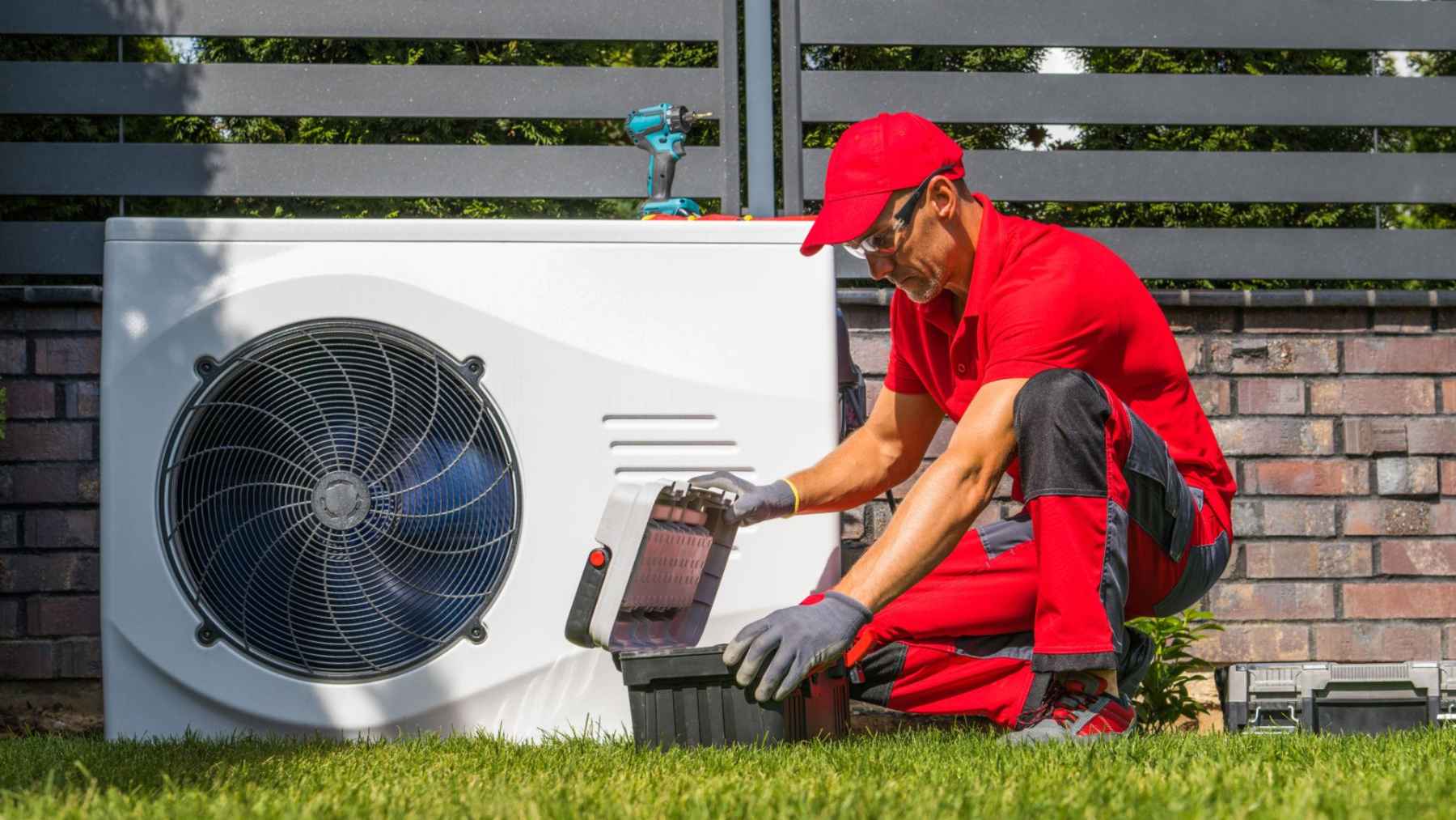 ECOnews 1 Technician installing a residential heat pump system as part of the transition to electric home heating.