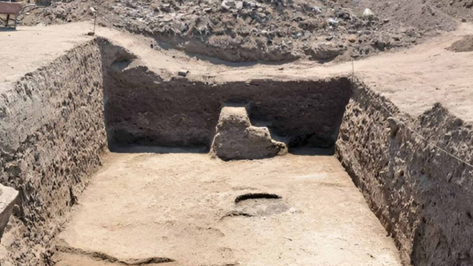 Archaeologists excavating the mudbrick walls of multi-story tower houses in the ancient city of Imet.