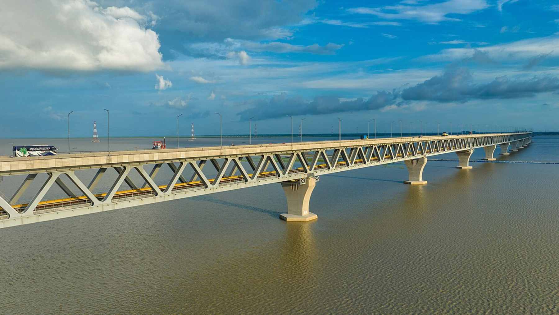 Bangladesh approves a 1.3-mile mega-dam to store about 2.35 million acre-feet of water and benefit 70 million people, amid rising pressure on the Padma River and growing water scarcity 1 An aerial rendering of the proposed Padma Barrage construction site near Pangsha, highlighting the 1.3-mile infrastructure spanning the river.