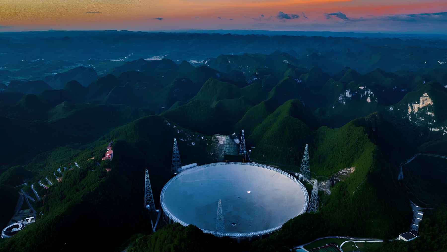 China’s FAST radio telescope in Guizhou, the world’s largest single-dish radio telescope, seen among mountains at sunset