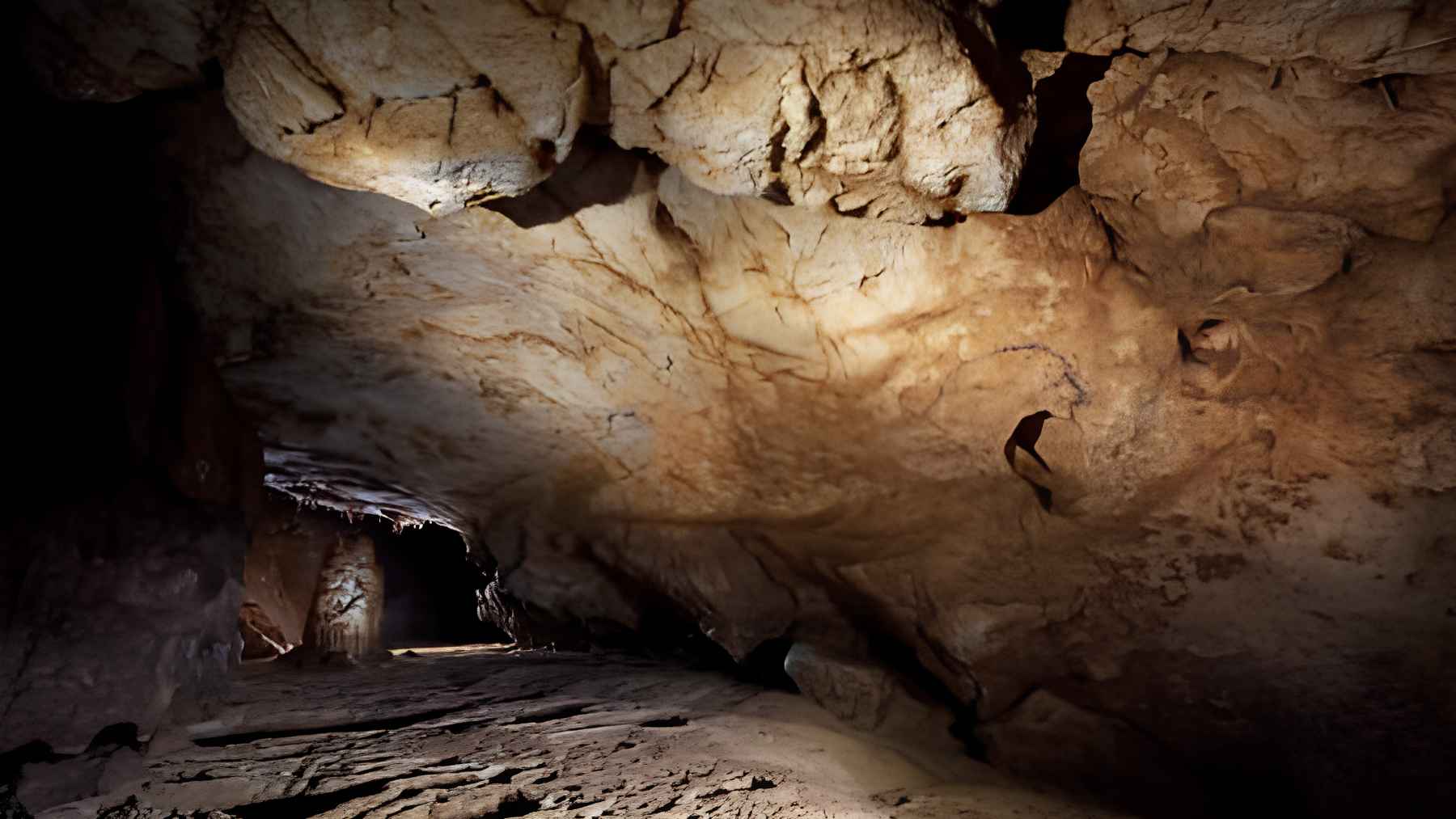 Interior view of a karst cave chamber in Romania with rocky walls and underground passage