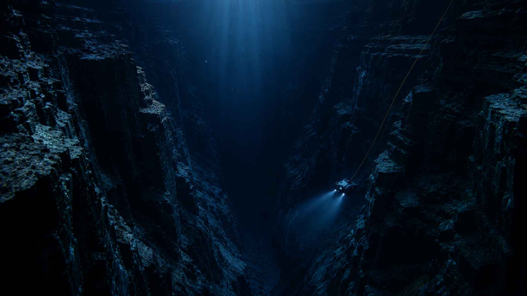 Illustration of a deep underwater canyon with steep rocky walls and a submersible exploring the abyss in the Bering Sea.