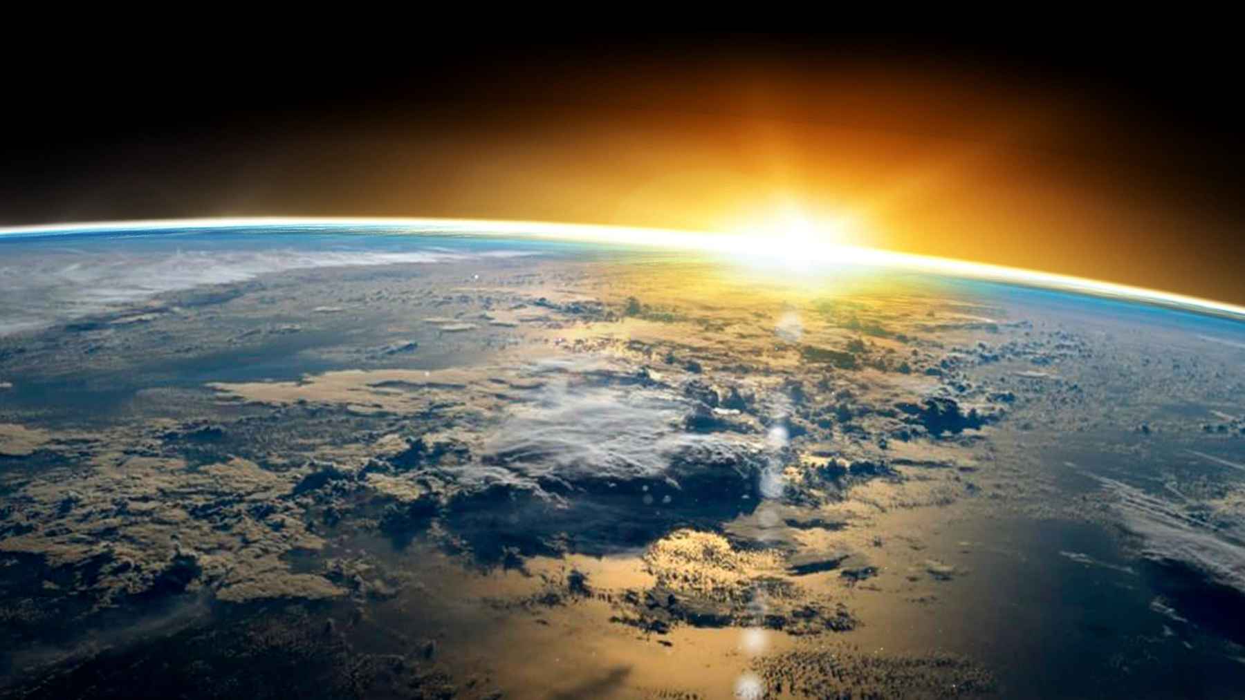 Earth seen from space with sunlight over oceans and clouds, representing global sea level and climate risk