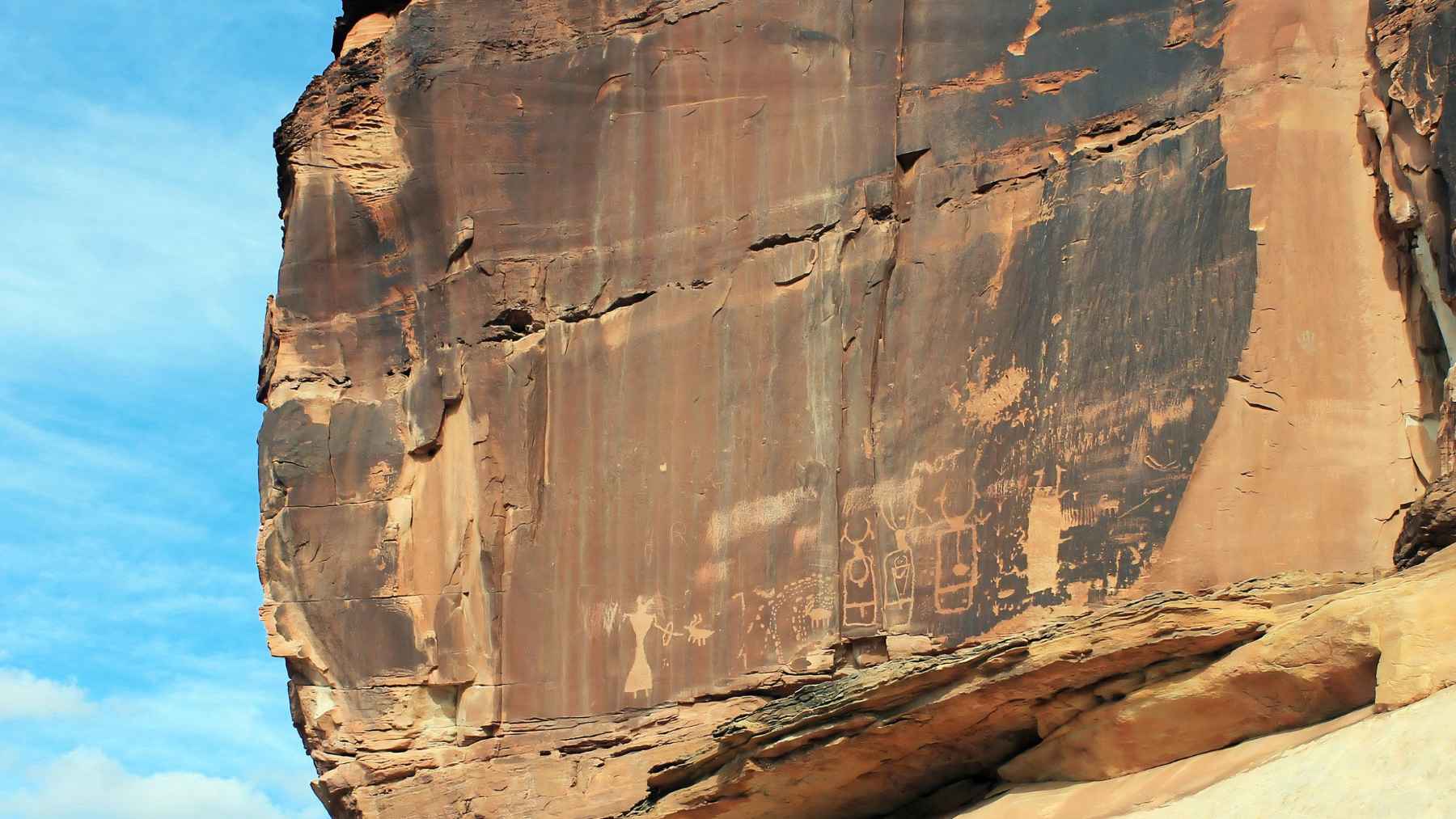 Ancient petroglyphs etched into a sandstone cliff in Grand Staircase-Escalante National Monument, Utah.