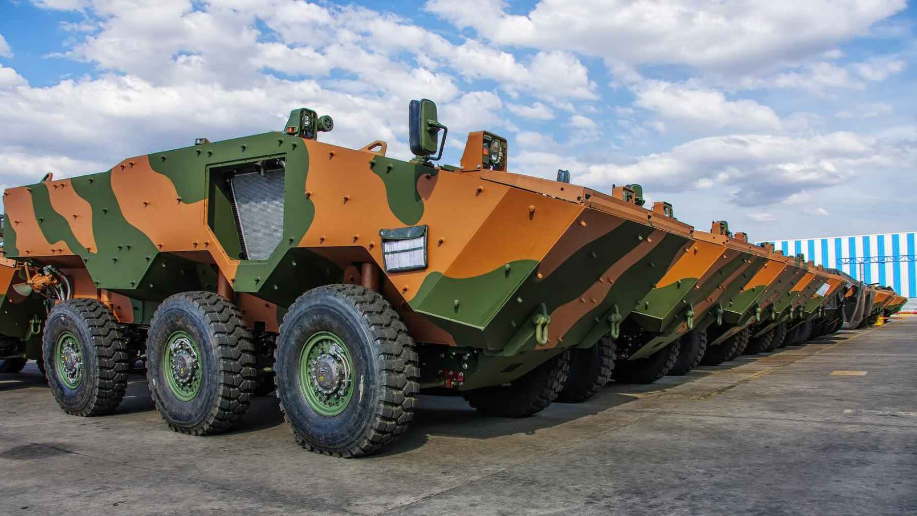At about 39,700 pounds with six wheels, a V-shaped hull, and amphibious capability, Brazil’s Guaraní armored vehicle carries 11 troops across water and rough terrain, and its design shows how mobility is being modernized 1 Multiple Guarani 6x6 armored vehicles lined up in a production facility in Brazil.