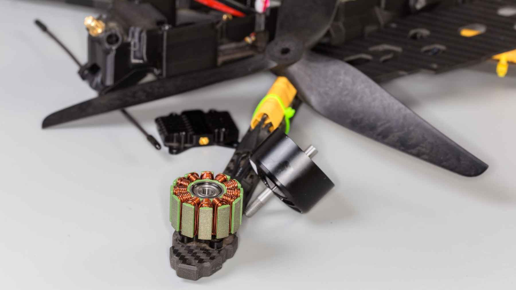 High-speed drone propeller and brushless motor components used in a custom FPV quadcopter.