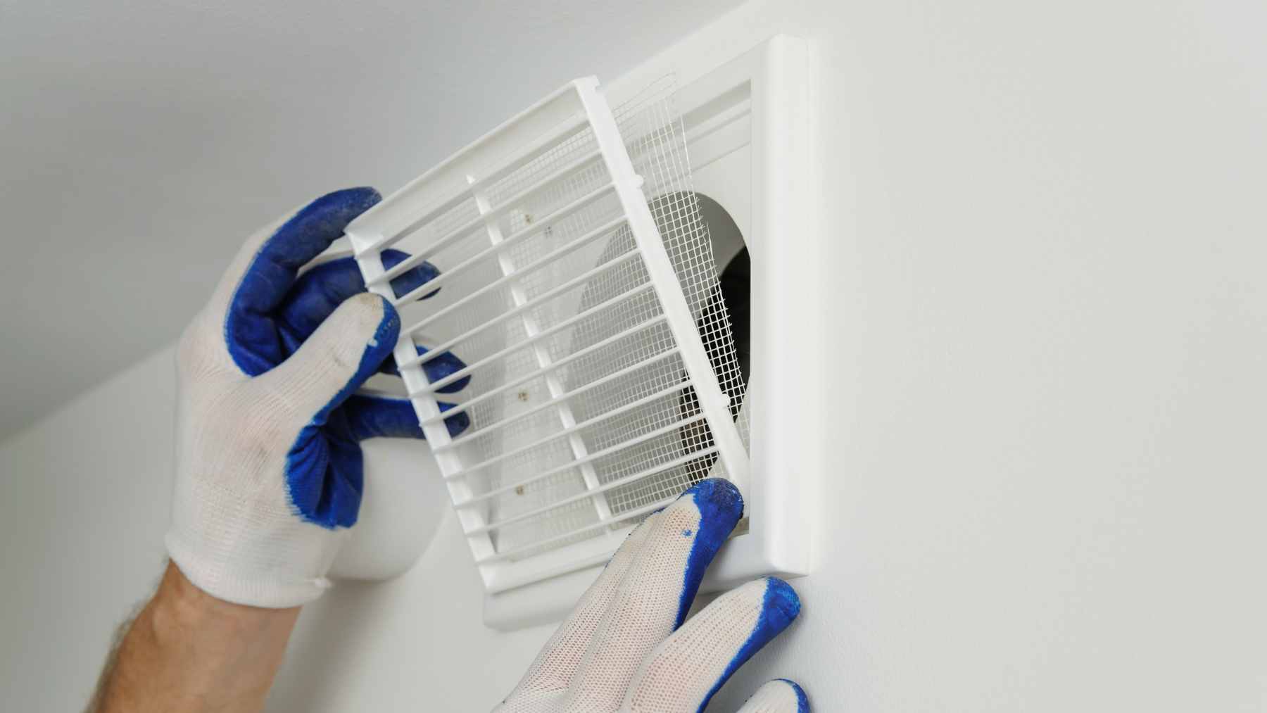 Closing vents in unused rooms sounds smart, but HVAC experts warn it can raise pressure, waste energy, and even damage your system over time 1 A close-up of a residential wall-mounted HVAC air vent, demonstrating the airflow that is restricted when these registers are closed.