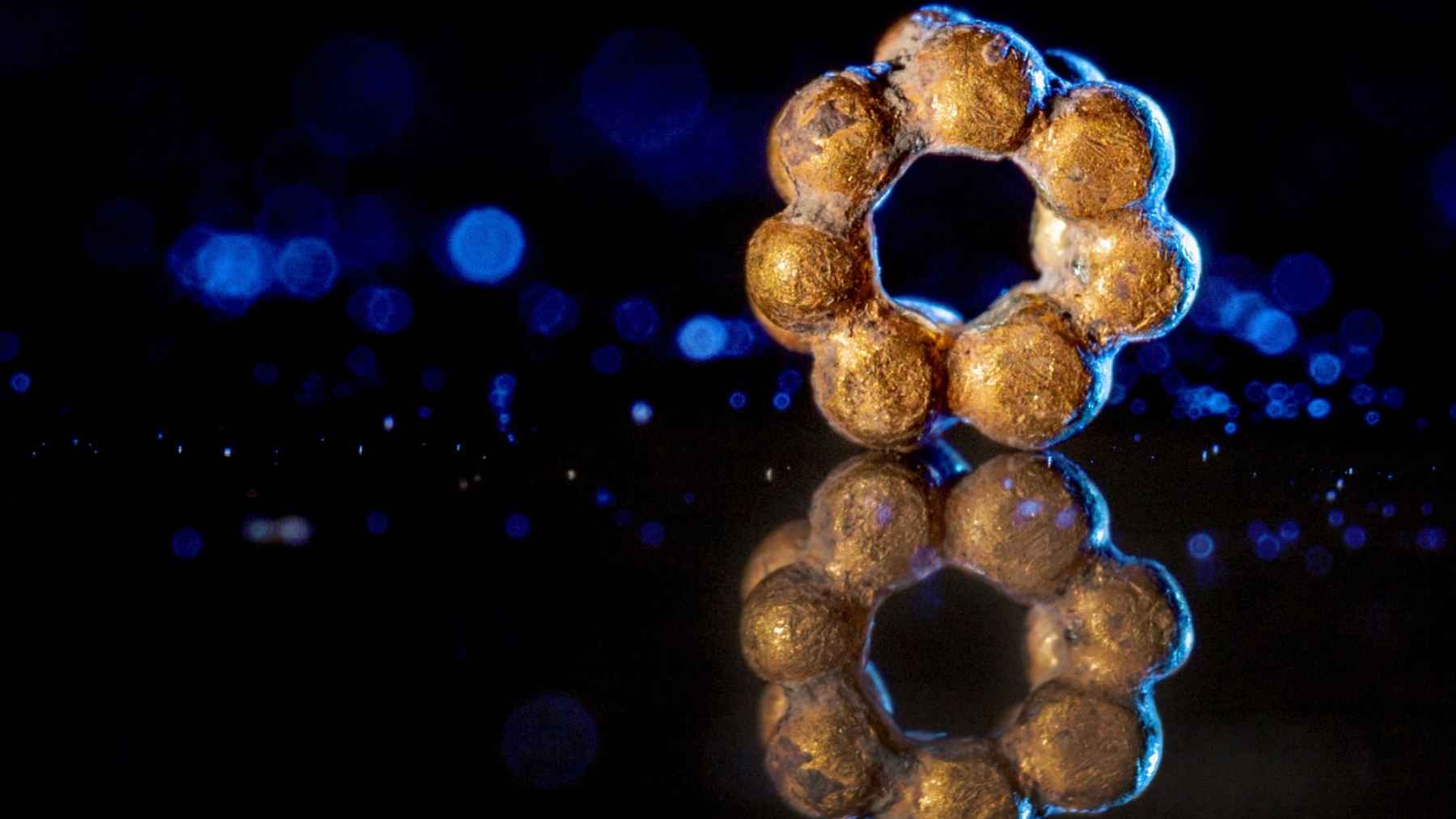 Ancient gold bead discovered in the City of David, dated to about 1600 years ago and made with a granulation technique.