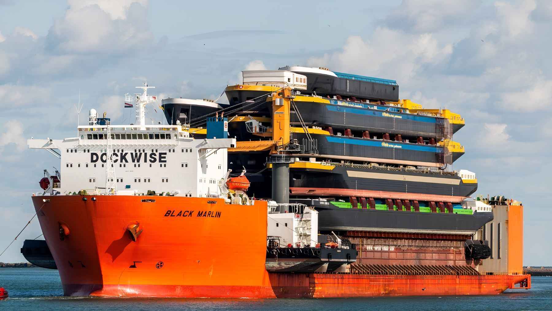 MV Black Marlin heavy-lift ship carrying large marine cargo on its deck during transport.