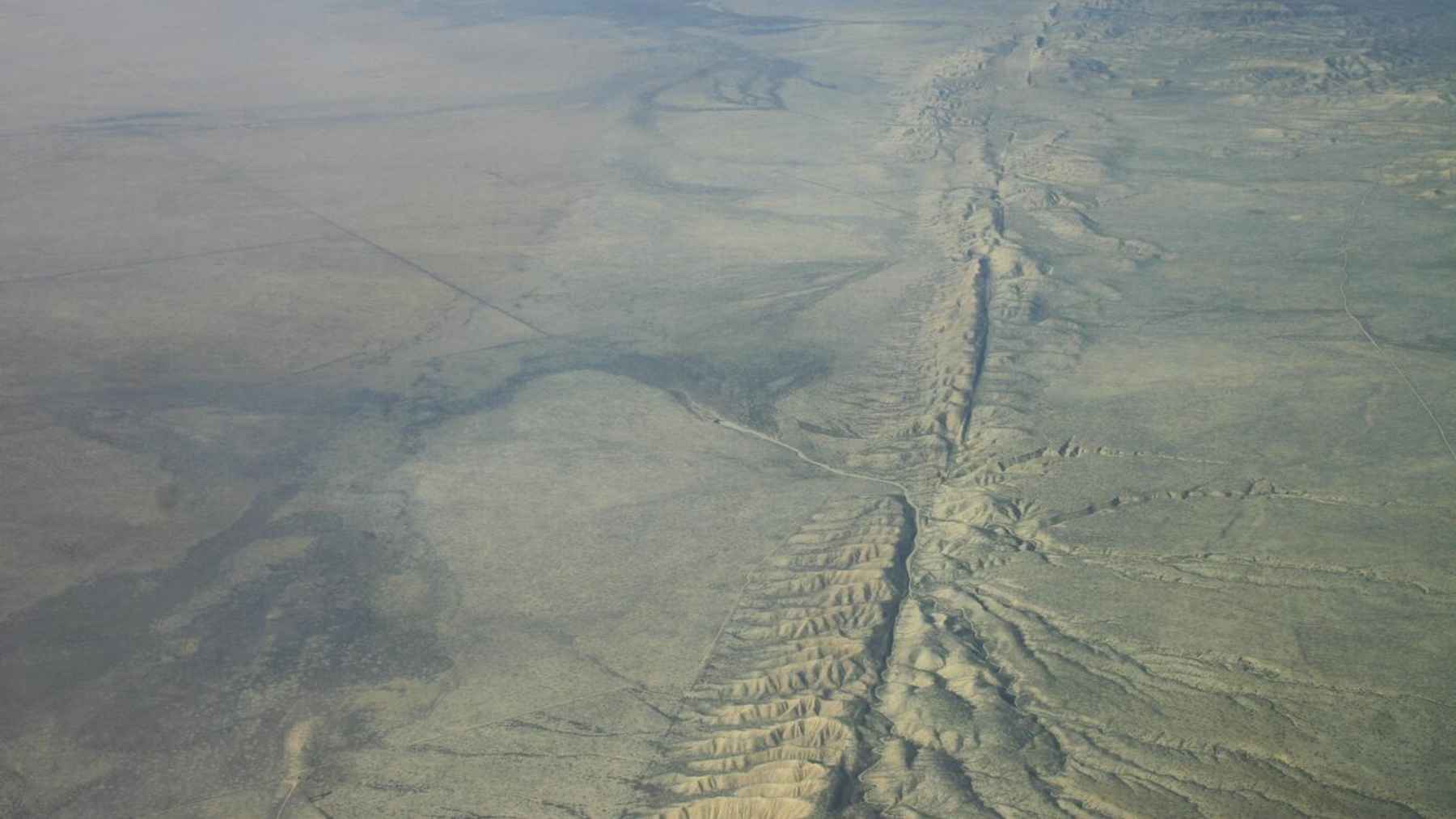 Aerial view of the San Andreas Fault cutting across an arid landscape in California.