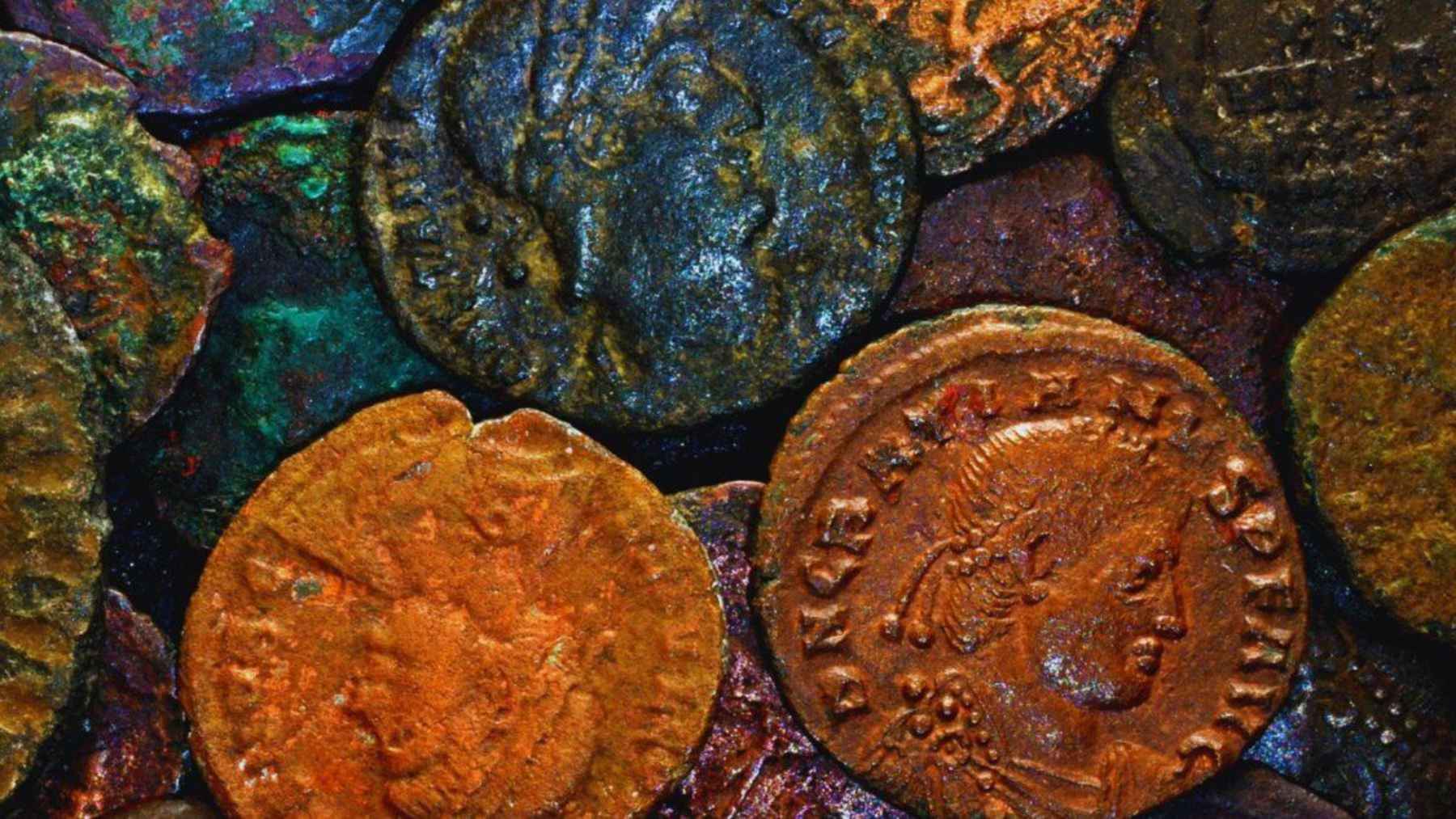 A diver finds a hidden stash of coins underwater, and what looked like debris becomes the treasure find of a lifetime 1 Close-up of late Roman bronze coins from the underwater hoard discovered near Arzachena, Sardinia.