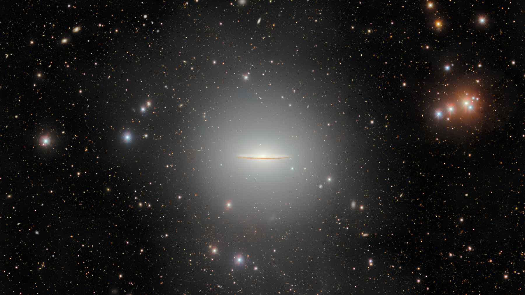Scientists detect an invisible halo around the Sombrero Galaxy for the first time, 30 million light-years away, and its extra size changes what we thought we knew about a cosmic postcard 1 Wide DECam image of the Sombrero Galaxy surrounded by a faint stellar halo and a dense field of distant stars.