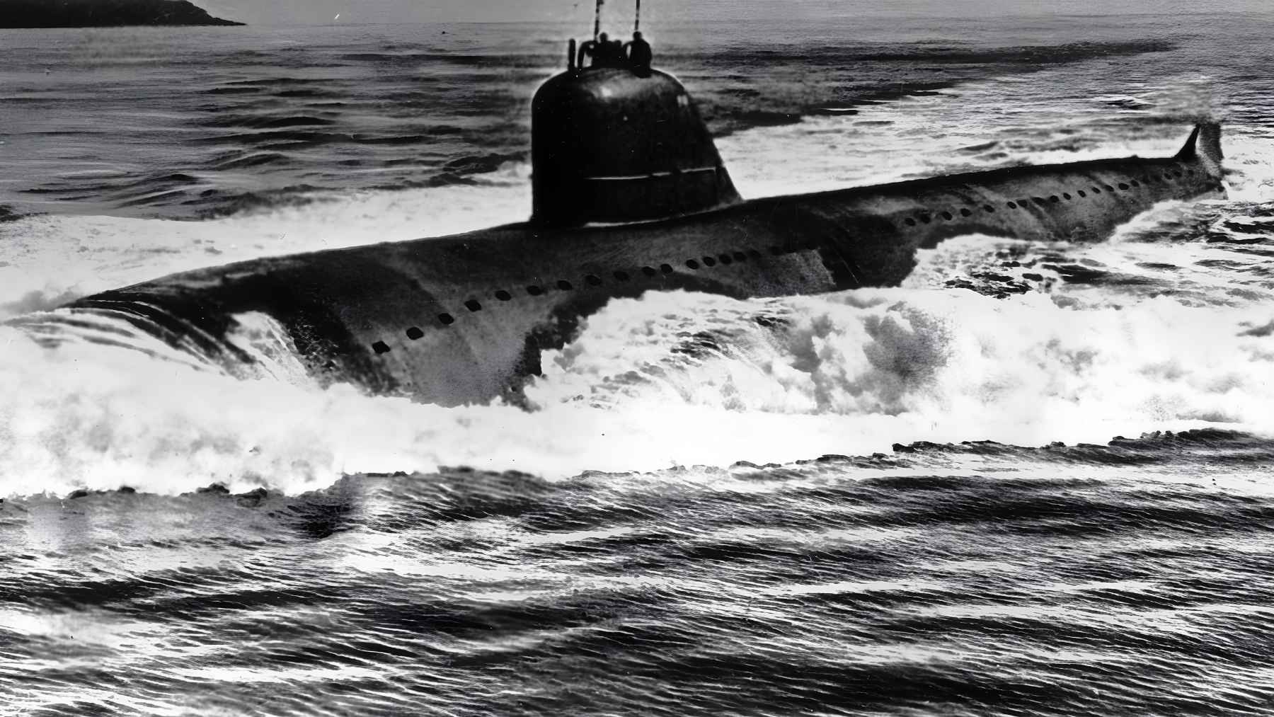 A sunken Soviet submarine is reportedly releasing radiation, and the leak revives fears about Cold War wrecks still poisoning the ocean 1 Black and white archive photo of a Soviet nuclear submarine at sea before it later sank and became a source of radioactive leakage.