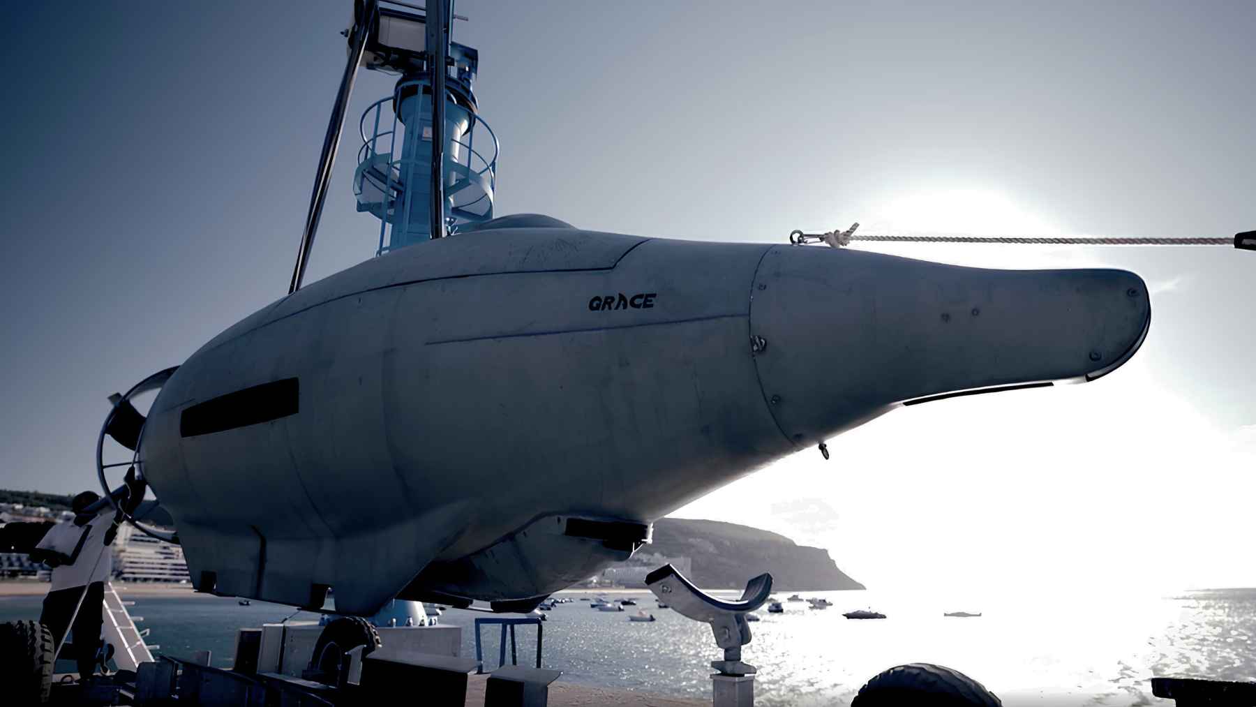 Autonomous underwater vehicle being deployed near the coast during testing operations.