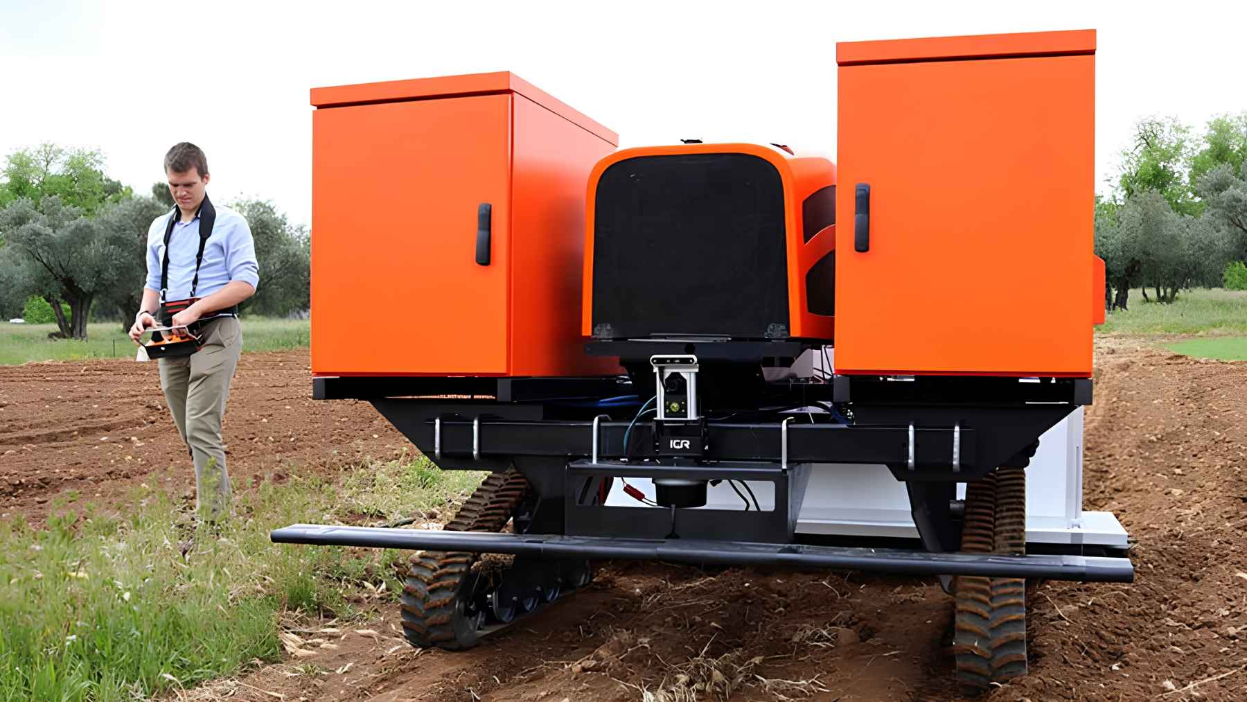 Autonomous agricultural robot used for laser weed control moving through a crop field.