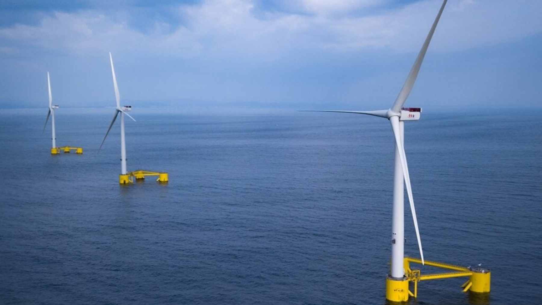 Floating wind turbine platforms at the WindFloat Atlantic project, serving as an artificial reef for marine life off the Portuguese coast.
