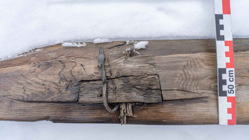 Ancient birch and leather ski bindings preserved on a 1,300-year-old wooden ski from Norway.