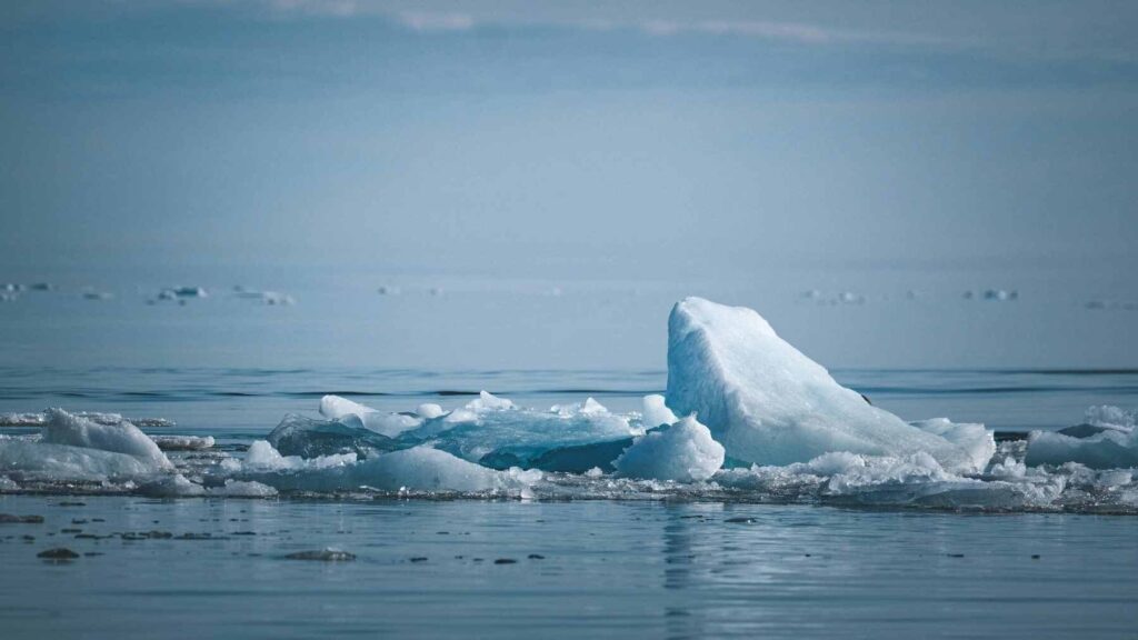 Researchers conducting a field test in Cambridge Bay, Nunavut, where seawater is pumped onto sea ice to increase its thickness and reflectivity.