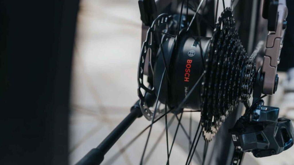 Close-up of the Bosch Hub Line rear hub motor integrated with cassette and disc brake on an e-bike wheel.
