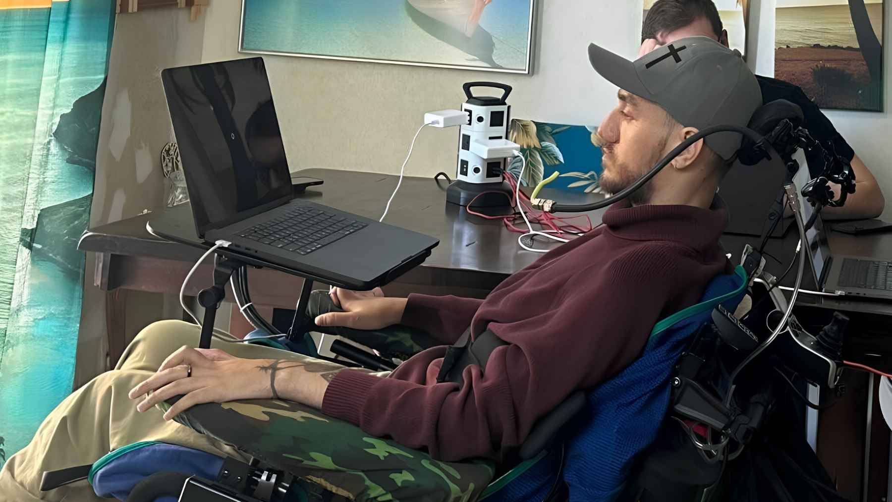 ALS patient using a brain-computer interface at home to communicate through a laptop