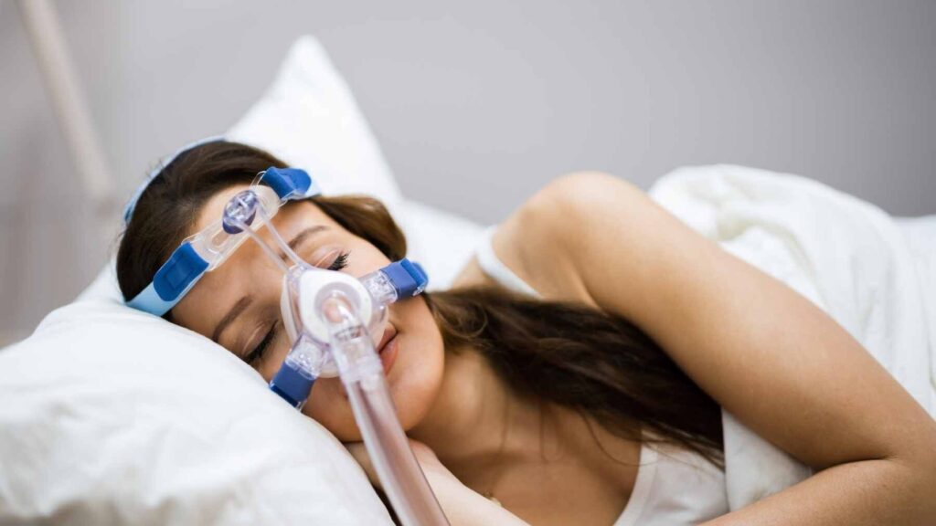 A medical professional performing a nasal lavage procedure on a patient to collect samples for microplastic analysis.