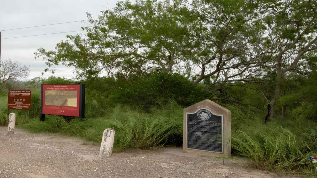 Historic marker and interpretive signs at the Palmito Ranch Battlefield National Historic Landmark in South Texas.