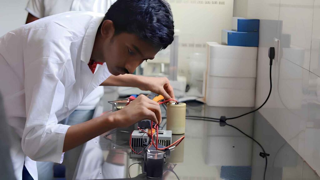 Zabeer Zarif Akhter assembling and testing his plasma water purification prototype powered by recycled electronics.