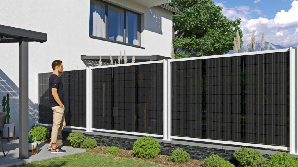 Modern solar fence panels installed along a residential boundary in a backyard setting