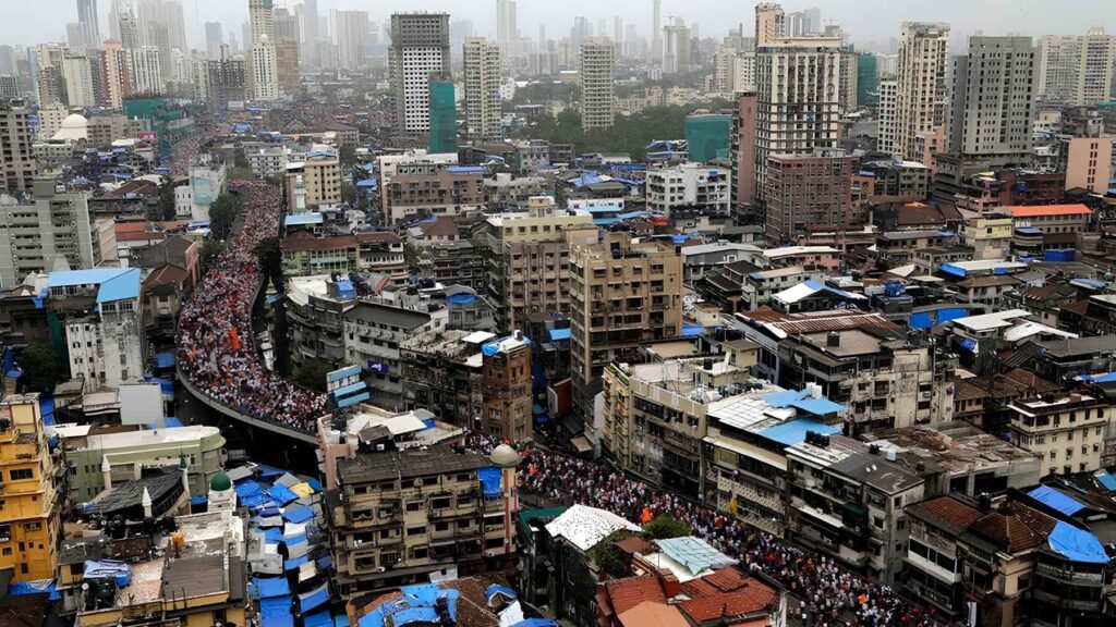 High-density city with massive crowds showing how population density reshapes social networks