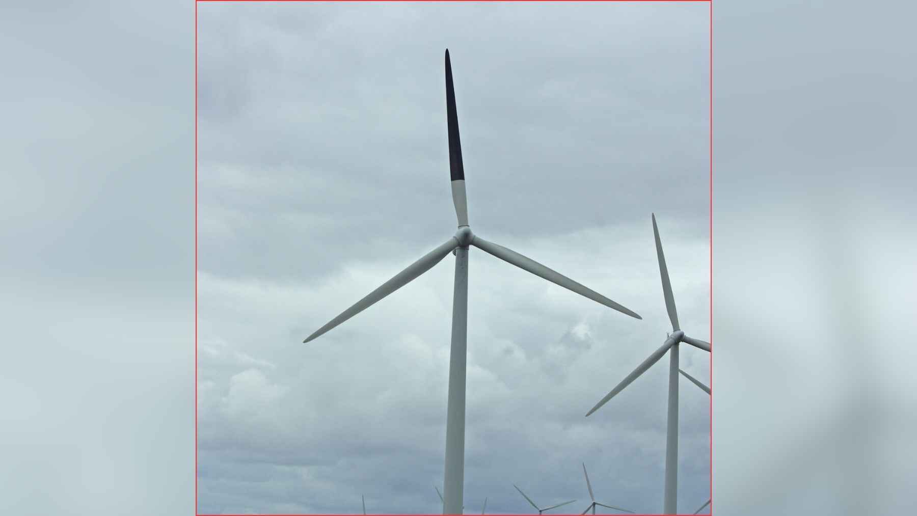 Wind turbine with one blade painted black at the Smøla wind farm in Norway.