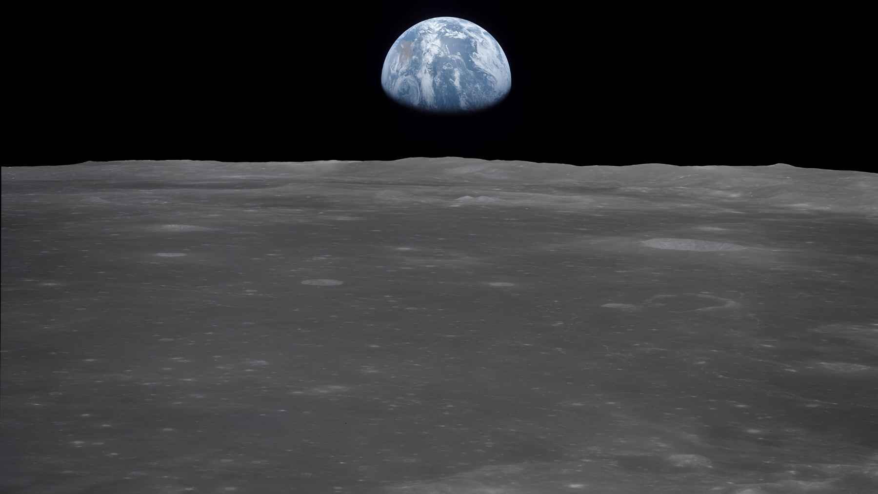 Earth appears above the lunar horizon in a NASA image, a striking view of the two worlds whose gravitational interaction has changed Earth's rotation over time.