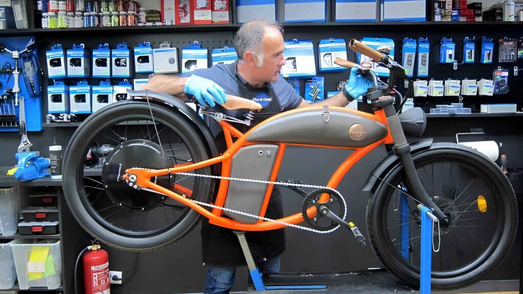 Bicycle mechanic repairs an electric bicycle in a professional workshop as Spain launches specialized vocational training for e-bike technicians.