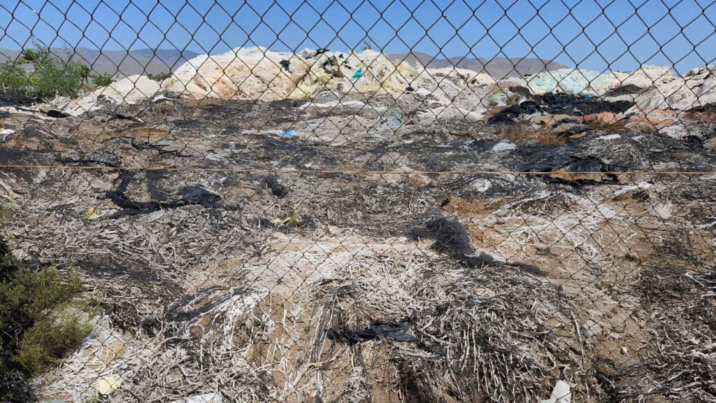 Discarded greenhouse raffia twine and plastic waste piled up at the illegal Boqueras Altas dump in Almería.