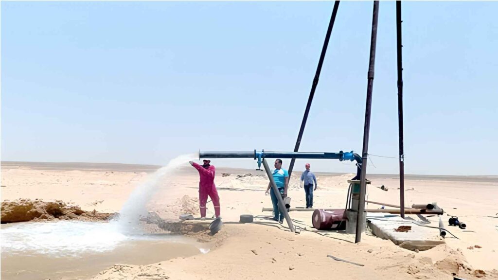 Groundwater pumped from a well in the Sahara Desert during water extraction operations.