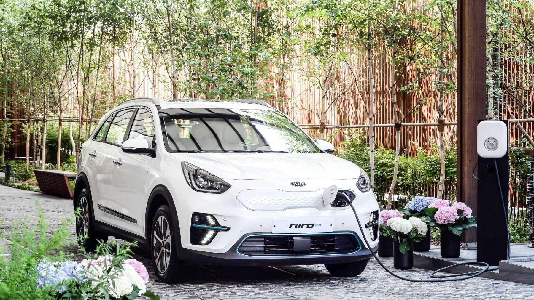 A Kia e-Niro charging at an EV station. The model recorded the highest battery health in a study of nearly 10,000 used electric vehicle battery tests.