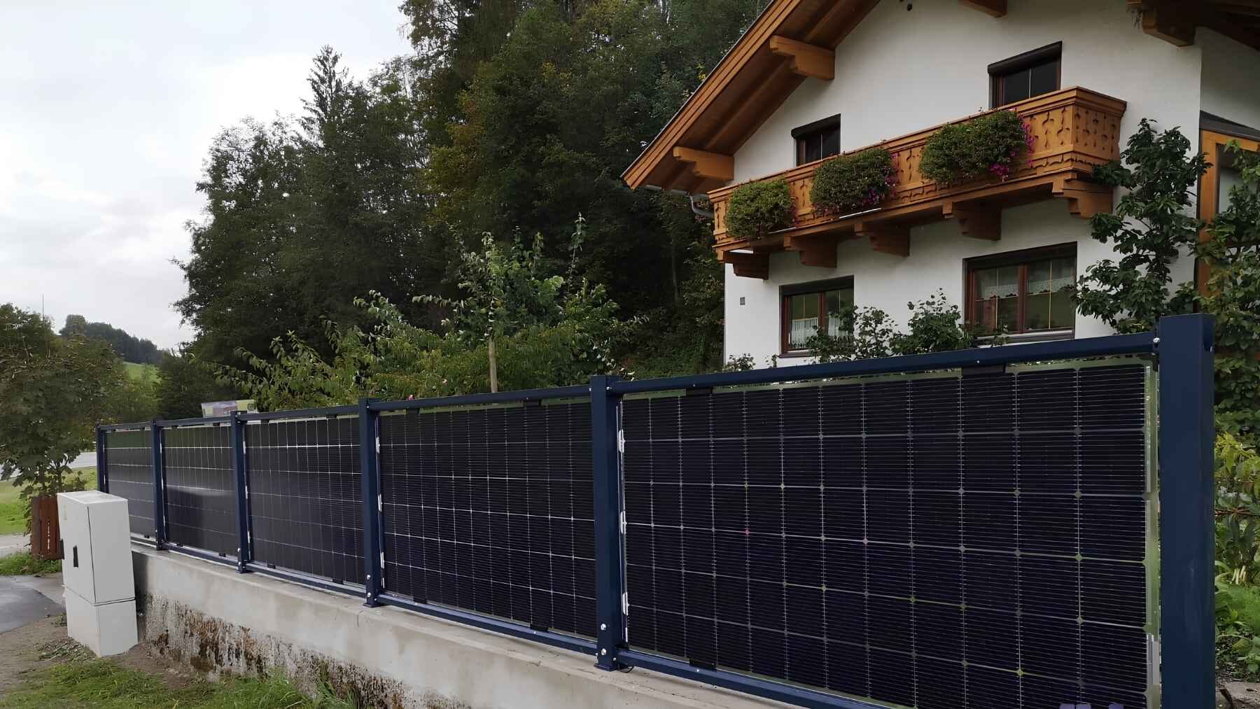 Next2Sun vertical solar fence with bifacial photovoltaic panels installed beside a home.