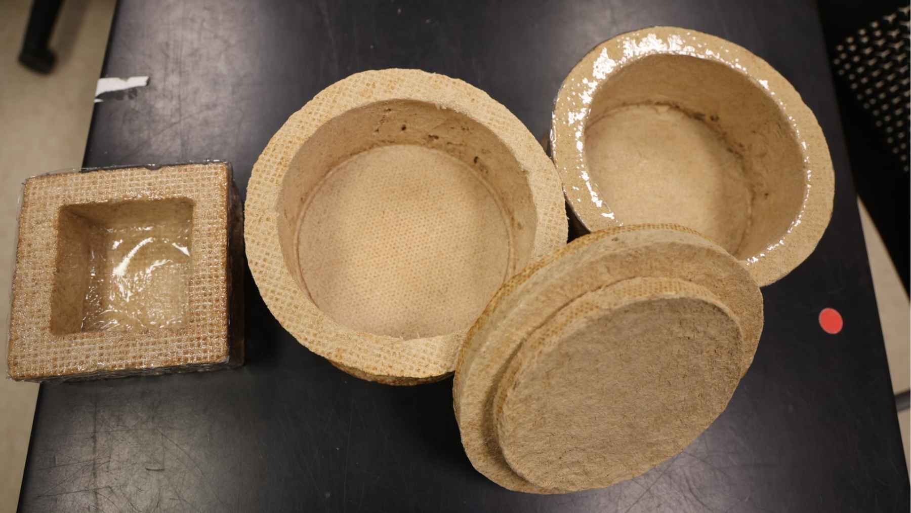 Wood-based foam cooler inserts developed at the University of Maine as an alternative to polyurethane insulation.