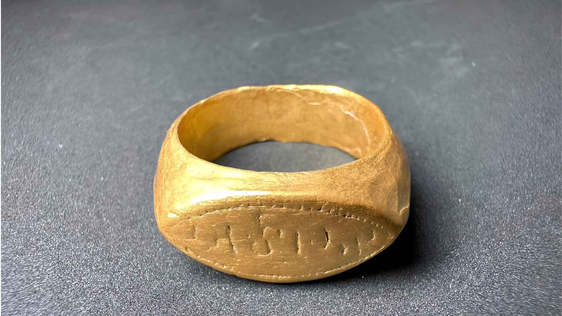 Ancient gold ring with a Brahmi inscription discovered at the Don Yai Thong archaeological site in Thailand.