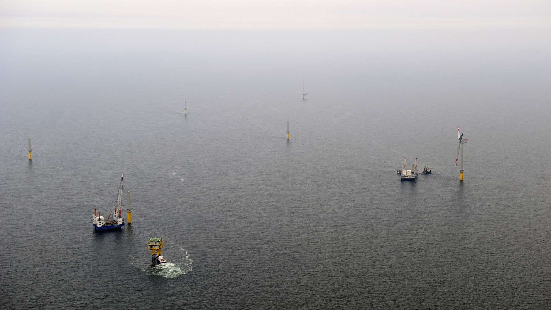 Vessels install turbine foundations at the Alpha Ventus offshore wind farm during construction.