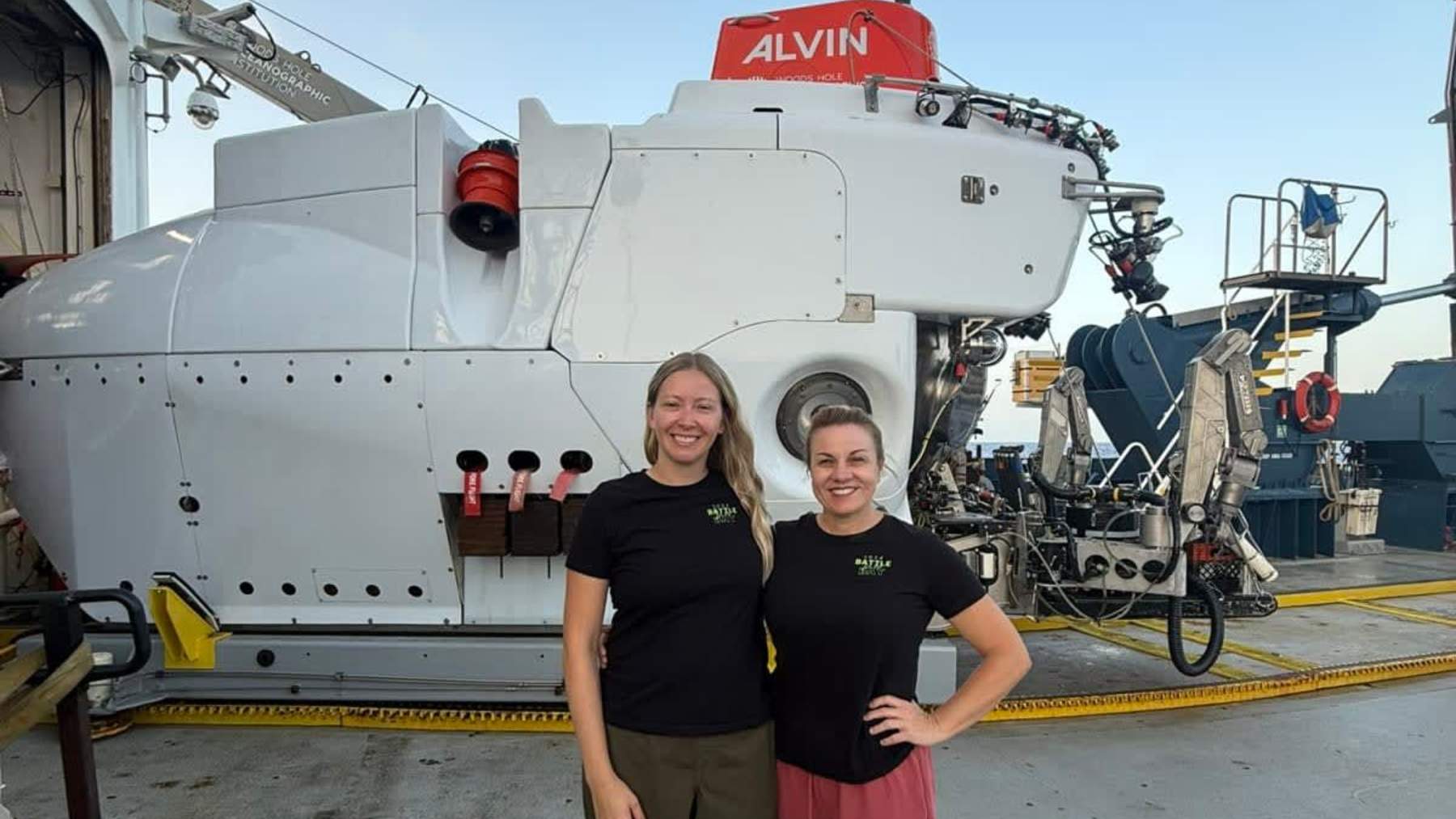 Scientists beside the submersible Alvin aboard a research ship