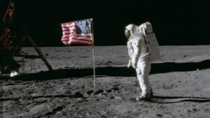 Astronaut Buzz Aldrin stands beside the American flag on the lunar surface during the Apollo 11 mission in July 1969