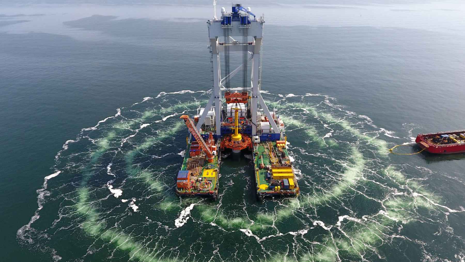 Double bubble curtain surrounding an offshore wind foundation installation at sea.
