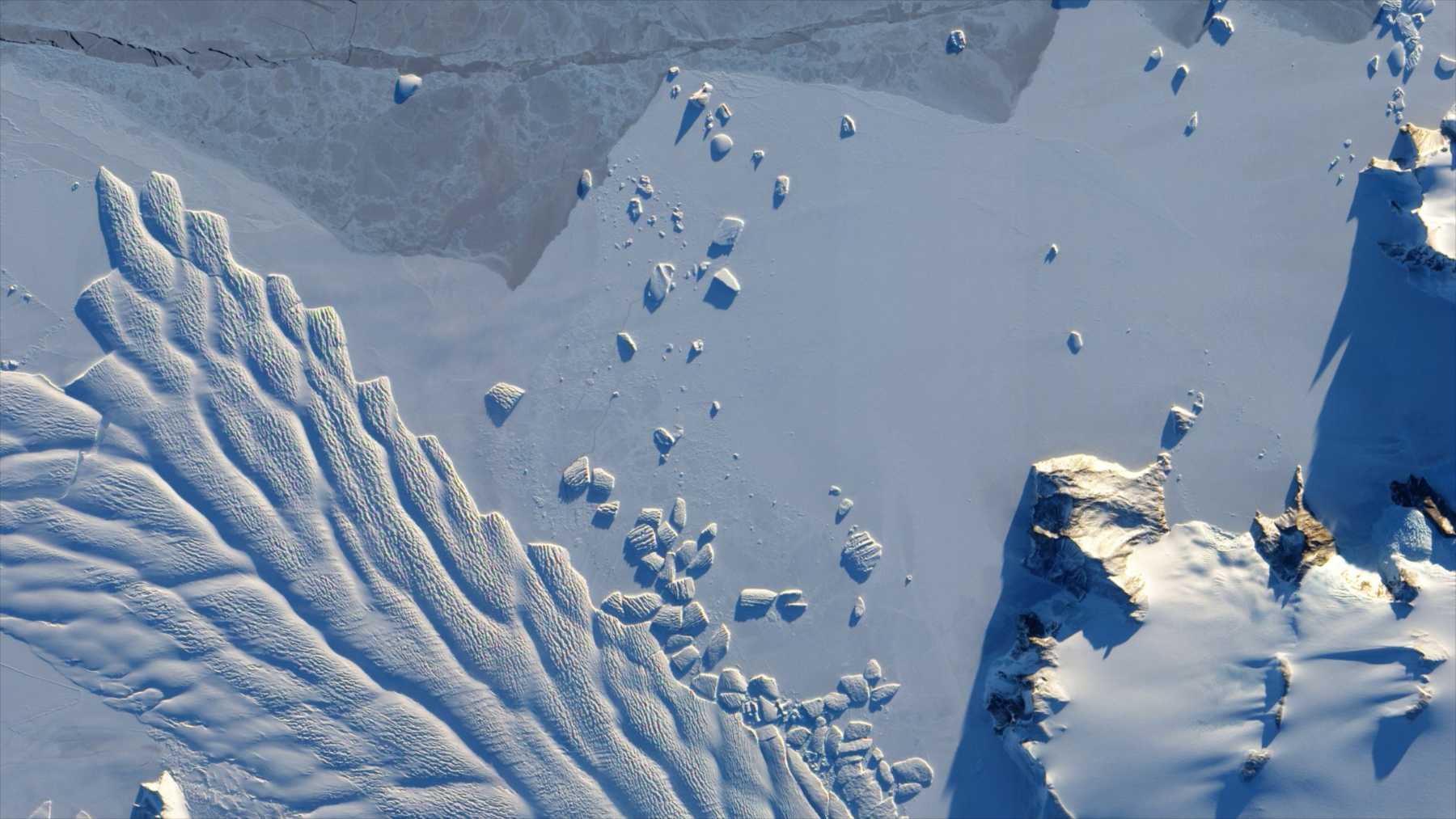 Crevassed ice and snow-covered terrain in East Antarctica photographed from an aircraft